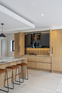 Ligna breakfast station revealed behind open oak pocket doors