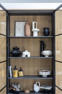 Open Ligna glazed display cabinet with oak shelves and decorative accessories